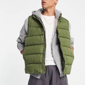 Green Asos design puffer vest. New with tags. Mens xs. Fits like a small.
